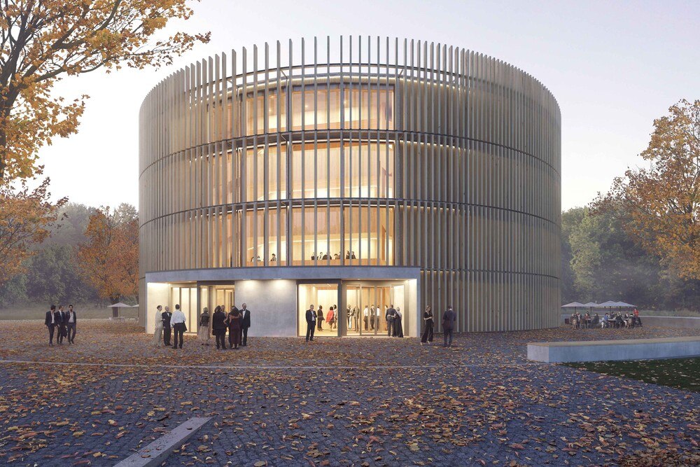 © Ingenieurgruppe Knörnschild & Kollegen
Das viergeschoßigen Globe-Theater: Der Eingangsbereich zeigt sich hell erleuchtet und öffnet sich innen nach oben über alle Geschoße. Für den Blick von innen nach außen hat man die Abstände der Lamellen der Fassade groß gewählt.
Das viergeschoßigen Globe-Theater: Der Eingangsbereich zeigt sich hell erleuchtet und öffnet sich innen nach oben über alle Geschoße. Für den Blick von innen nach außen hat man die Abstände der Lamellen der Fassade groß gewählt.