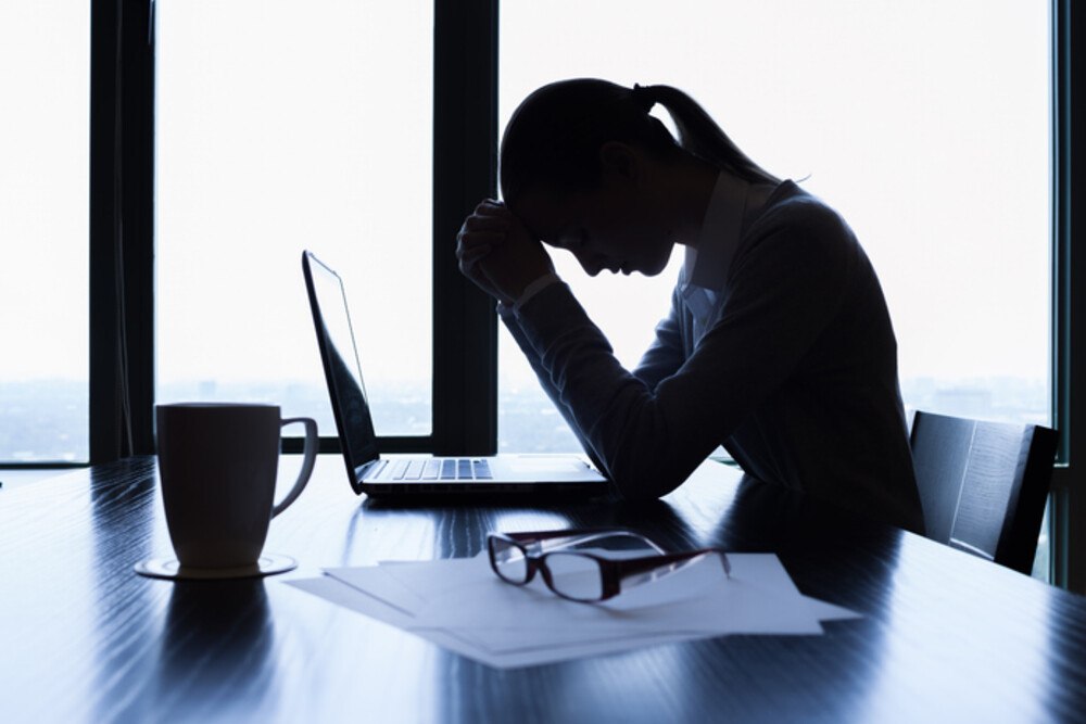 © kieferpix iStock / Getty Images Plus Gestresste Geschäftsfrau