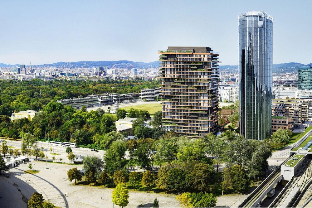 © OLN
Der Weitblick (rechts) wird in unmittelbarer Nähe zum Ernst-Happel-Stadion mit einem Lifestyle-Hotel und einer Rooftop-Bar mit Rundumblick auf Wien beindrucken.
Rendering des neuen Hochhausprojekts. Ein großer Wolkenkratzer steht in der nähe vom Prater.
